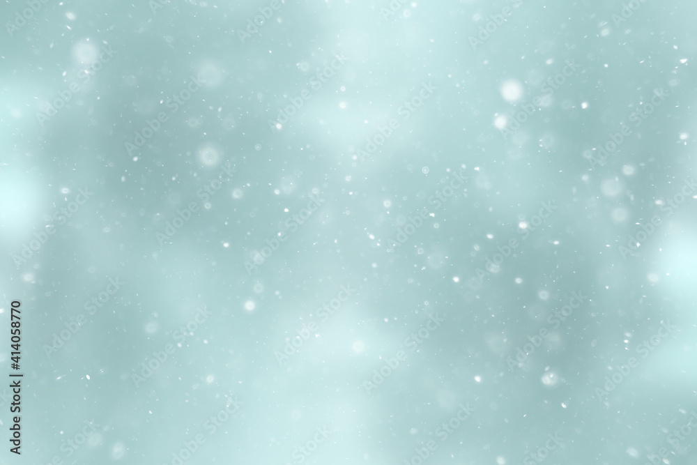 blurred snow / winter abstract background, snowflakes on abstract blurred glowing leaf background blurred snow / winter abstract background, snowflakes on abstract blurred glowing leaf background