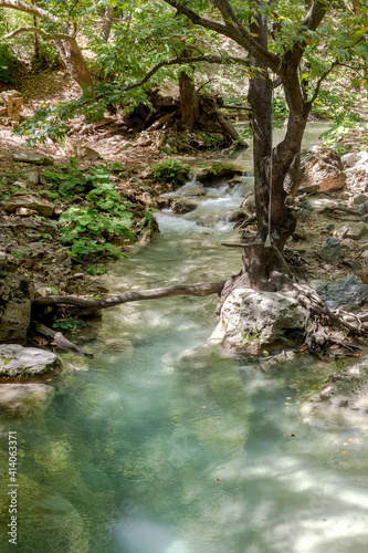 A fast mountain river flows on a sunny summer day  Central Macedonia  Greece 