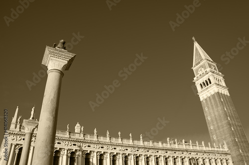 Column of the Lion, Column of San Teodoro, Campanile and the building of public Marciana Library (or Library of Saint Mark) at St Mark's Square in Venice, Italy. Sepia historic photo. photo