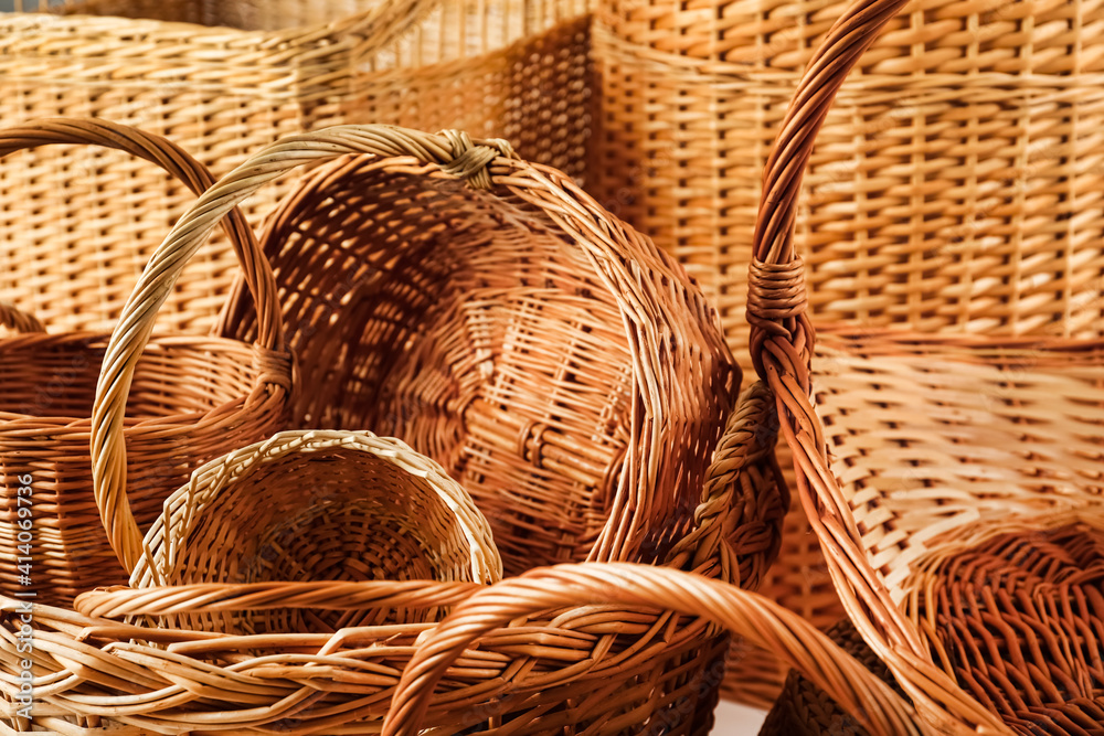 Many different wicker baskets made of natural material as background Many different wicker baskets made of natural material as background