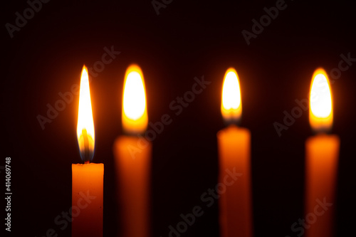 Beautiful candles burning against dark background