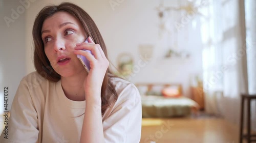 A worried woman talks about work. Overloading information. Chronic fatigue and stress