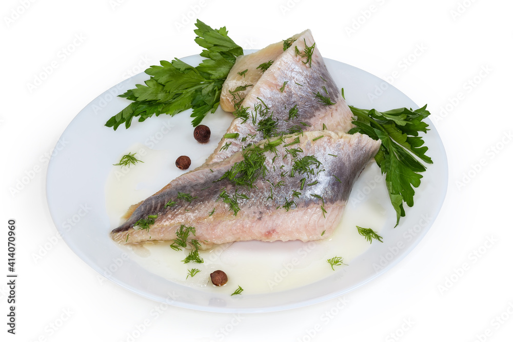 Pickled herring fillets sprinkled with chopped dill, parsley on dish Pickled herring fillets sprinkled with chopped dill, parsley on dish