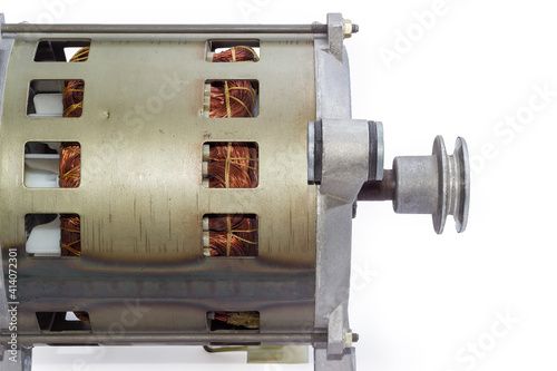 Fragment of electric motor with pulley, side view photo