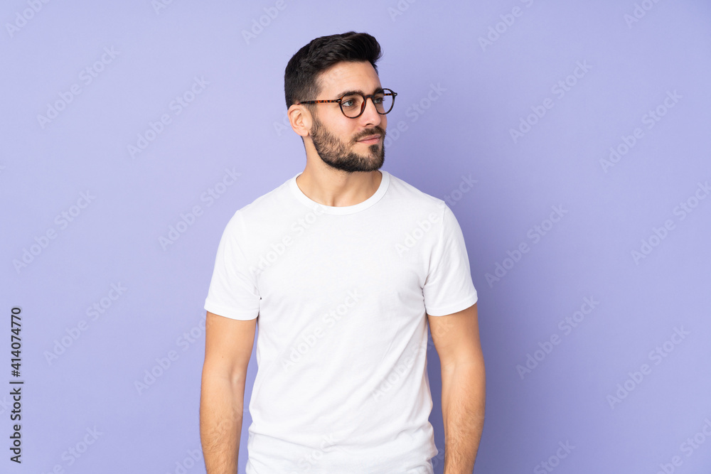 Caucasian handsome man over isolated background looking to the side Caucasian handsome man over isolated background looking to the side