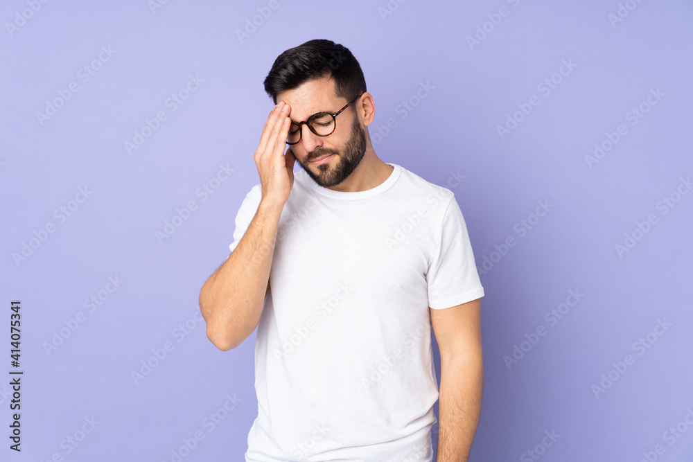 Caucasian handsome man over isolated background with headache Caucasian handsome man over isolated background with headache