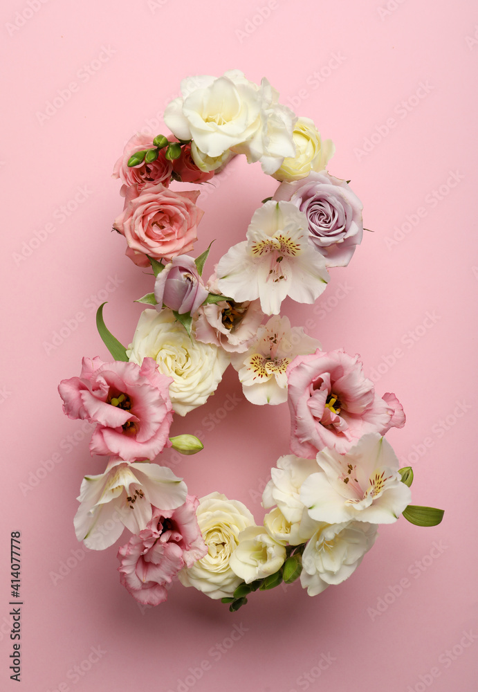 Number 8 made of beautiful flowers on pink background, flat lay. International Women's day