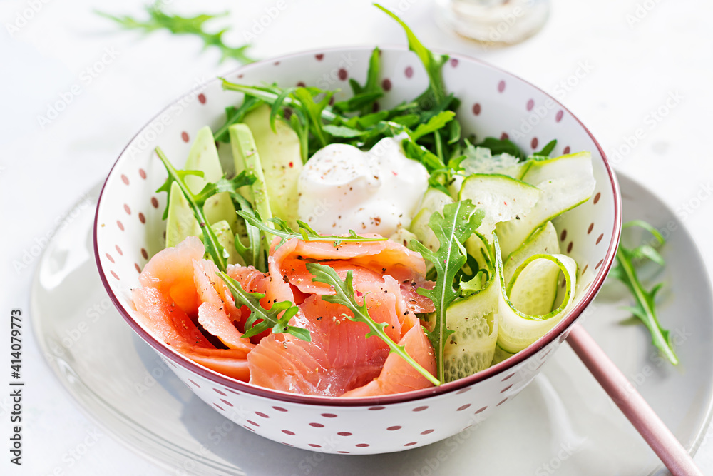 Ketogenic, keto diet. Salted salmon, avocado and cucumber salad with cream cheese in white bowl. Healthy food. Ketogenic, keto diet. Salted salmon, avocado and cucumber salad with cream cheese in white bowl. Healthy food.