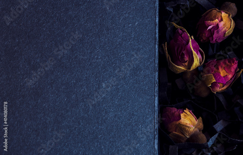 dry roses on black background