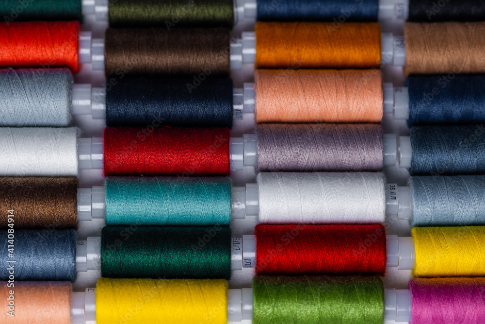 Sewing threads multicolored background close up Sewing threads multicolored background close up