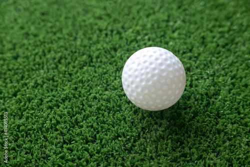 Golf ball on the grass with copy space.