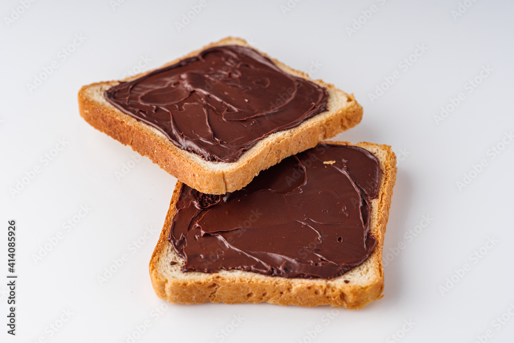 toasts with chocolate butter on a white acrylic background toasts with chocolate butter on a white acrylic background