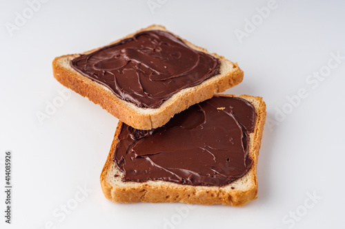 toasts with chocolate butter on a white acrylic background