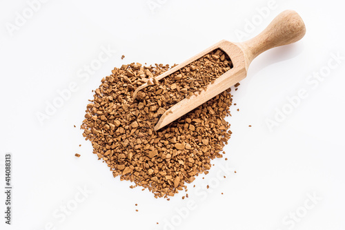 instant coffee granules on a white acrylic background
