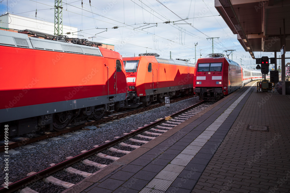 Predominate red electric locomotives in the station