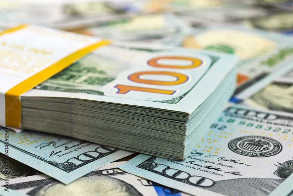 A stack of one hundred dollar bills A stack of one hundred dollar bills