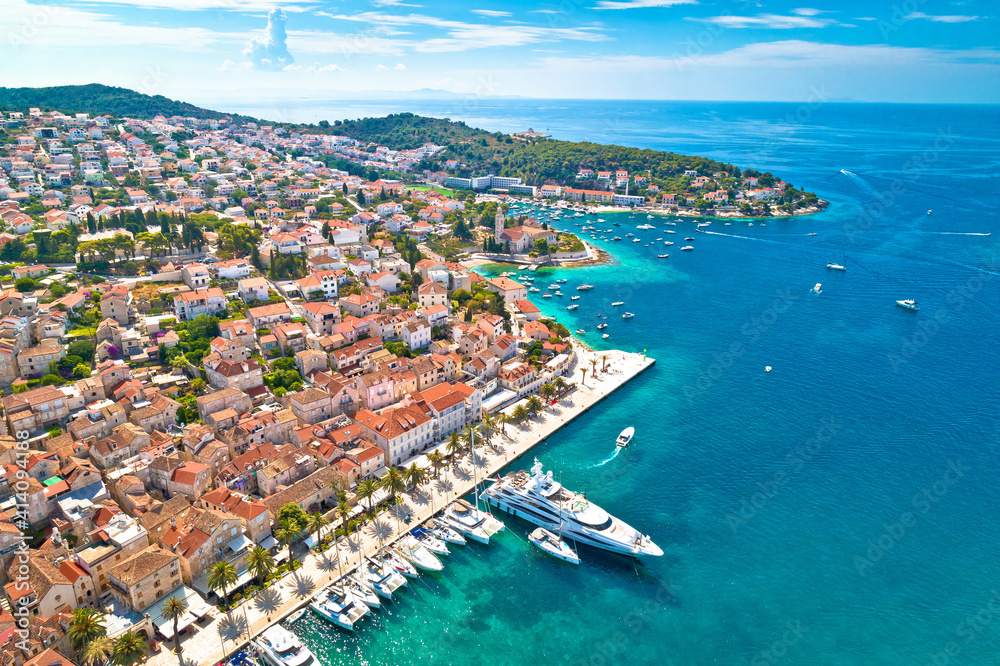 Town of Hvar bay and yachting harbor aerial view