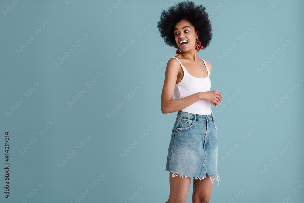 Happy african american girl smiling and looking aside Happy african american girl smiling and looking aside