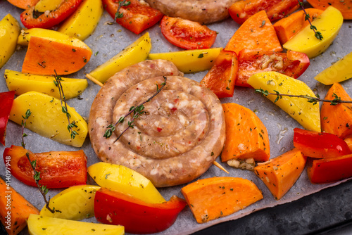 Uncooked chicken sausages with vegetables