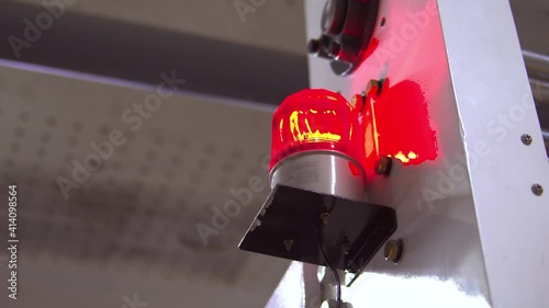 blurred low key Illuminated factory industry red alert emergency light with copy space for background. Attention concept, tragedy, emergency, safety and insurance