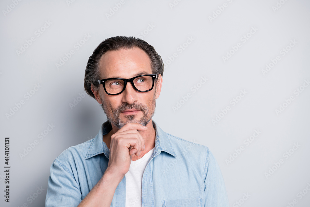 Photo of mature handsome man dream dreamy think wonder idea look empty space isolated over grey color background Photo of mature handsome man dream dreamy think wonder idea look empty space isolated over grey color background