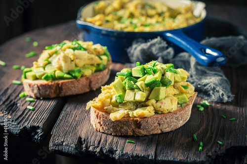 Healthy and fresh fried eggs with chive and avocado