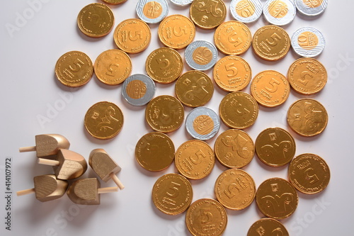 Hanukkah Chocolate shekel Coins. Delicious chocolate shekels in golden package. Hanukkah gelt with menorah.