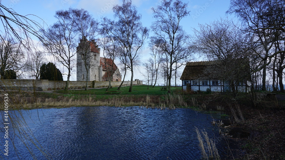 the lake in front of the Hojerup Old Church, Stevns Klint, on the island Zealand, Denmark, March the lake in front of the Hojerup Old Church, Stevns Klint, on the island Zealand, Denmark, March