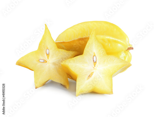 Cut and whole carambolas on white background