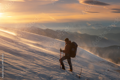 silhouette of a person on a mountain top