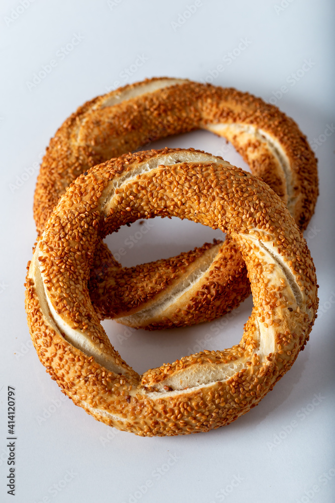 Traditional Turkish bagel (simit) on white background. Traditional Turkish bagel (simit) on white background.