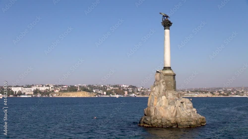 Monument to sunken ships Pedestal with column and bronze eagle on capitals is set on artificial rock protruding from sea. Crimea after referendum in 2014. Sevastopol, Russia, October, 2014. Monument to sunken ships Pedestal with column and bronze eagle on capitals is set on artificial rock protruding from sea. Crimea after referendum in 2014. Sevastopol, Russia, October, 2014.