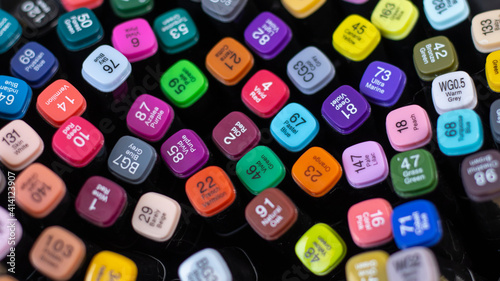 Professional multi-colored markers for drawing on a solid background. Close-up. Space for text, sketchbook drawing lessons, set for artists, creativity. Traded colors. 