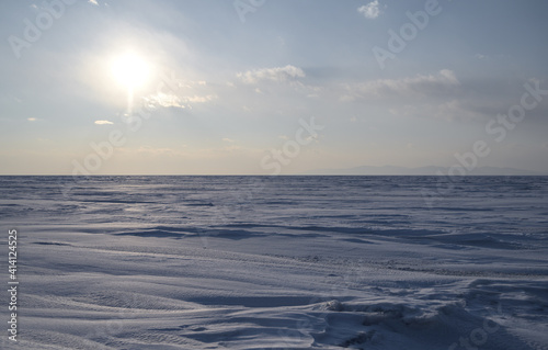 Frozen sea view on sunny day.