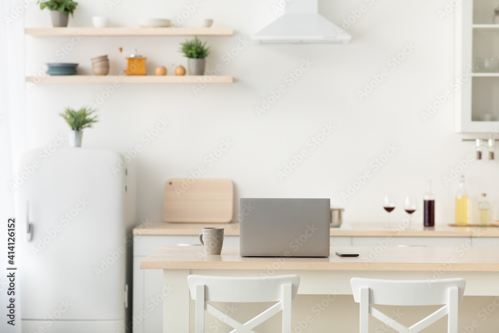 Fototapeta premium Simple interior, home office in kitchen during covid-19 quarantine