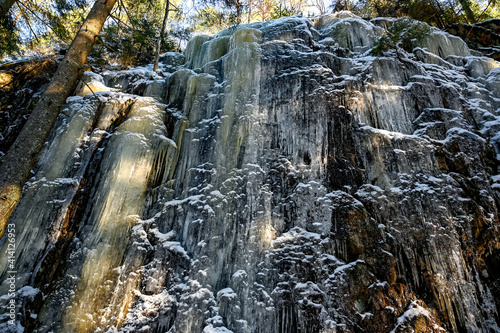 mountain side covered in ice in forest Narke Sweden