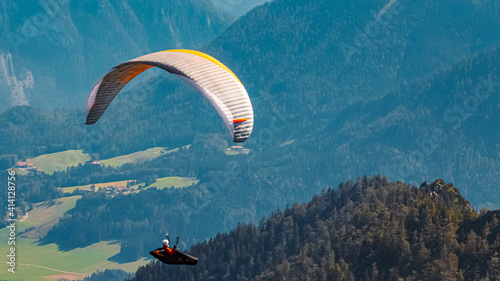 Beautiful alpine summer view with a paraglider at the famous Hochfelln summit, Bergen, Bavaria, Germany photo