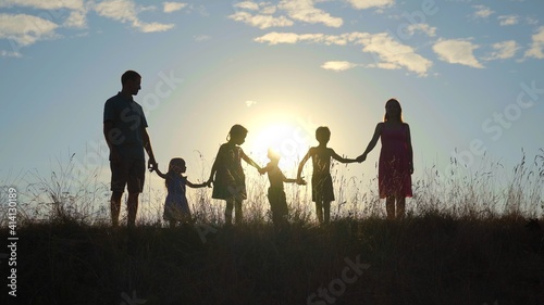 Happy large family at sunset with a dog. © Довидович Михаил
