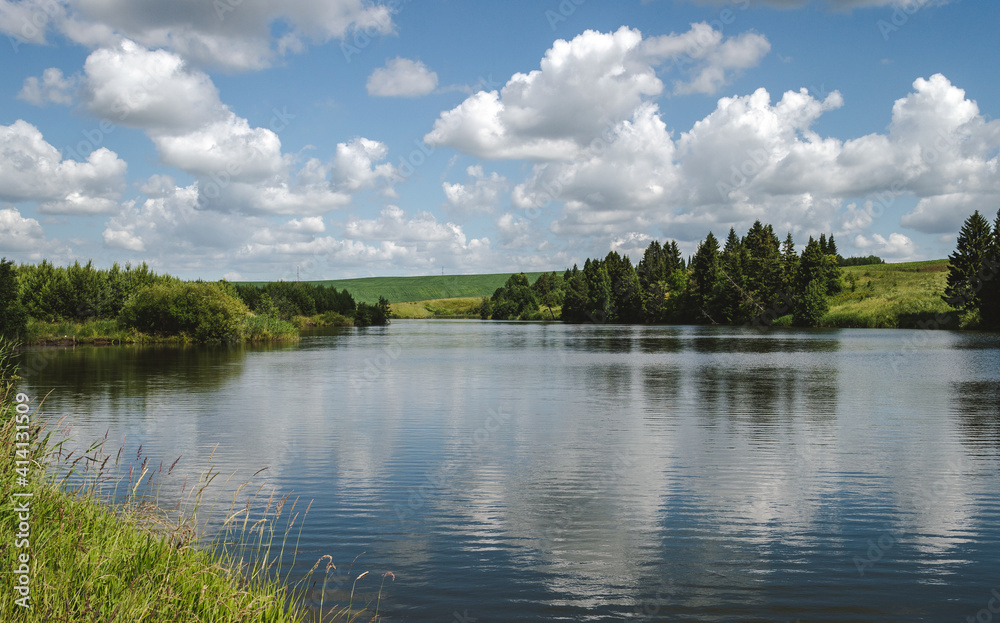 Calm landscape of lake with clouds, rural landscape Calm landscape of lake with clouds, rural landscape