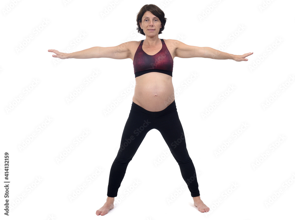 portrait of a pregnant woman exercising on white background, cross