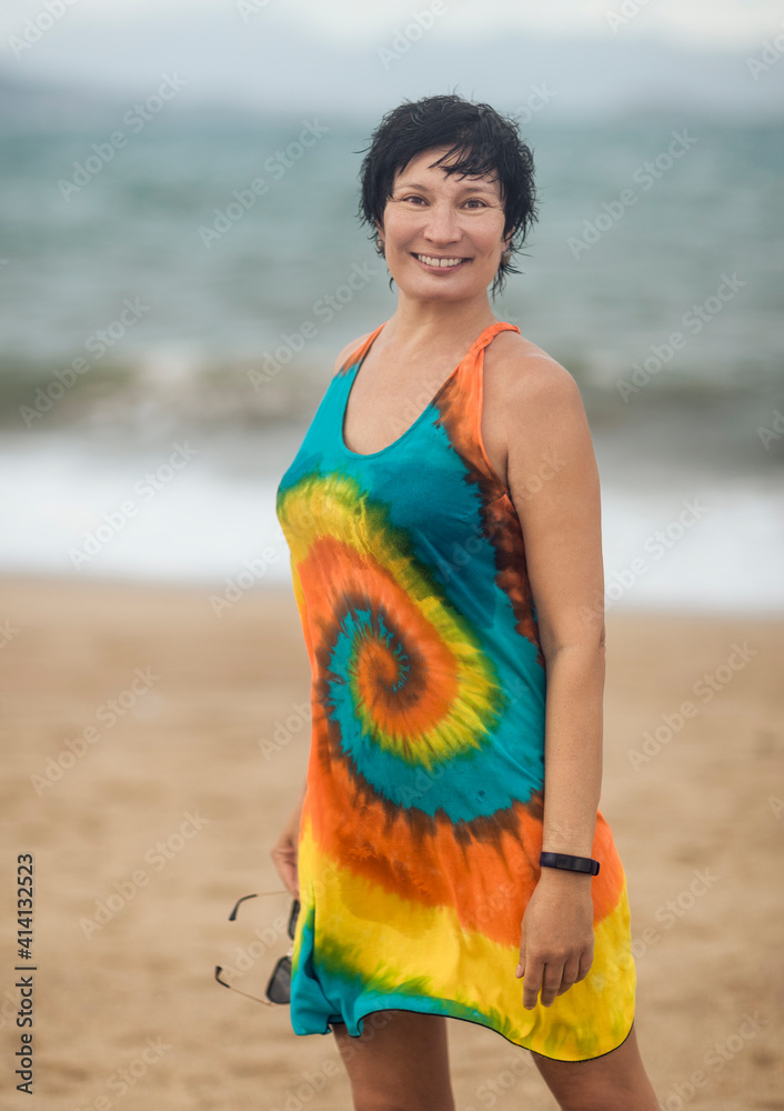 Outdoor portrait of a beautiful woman near the sea