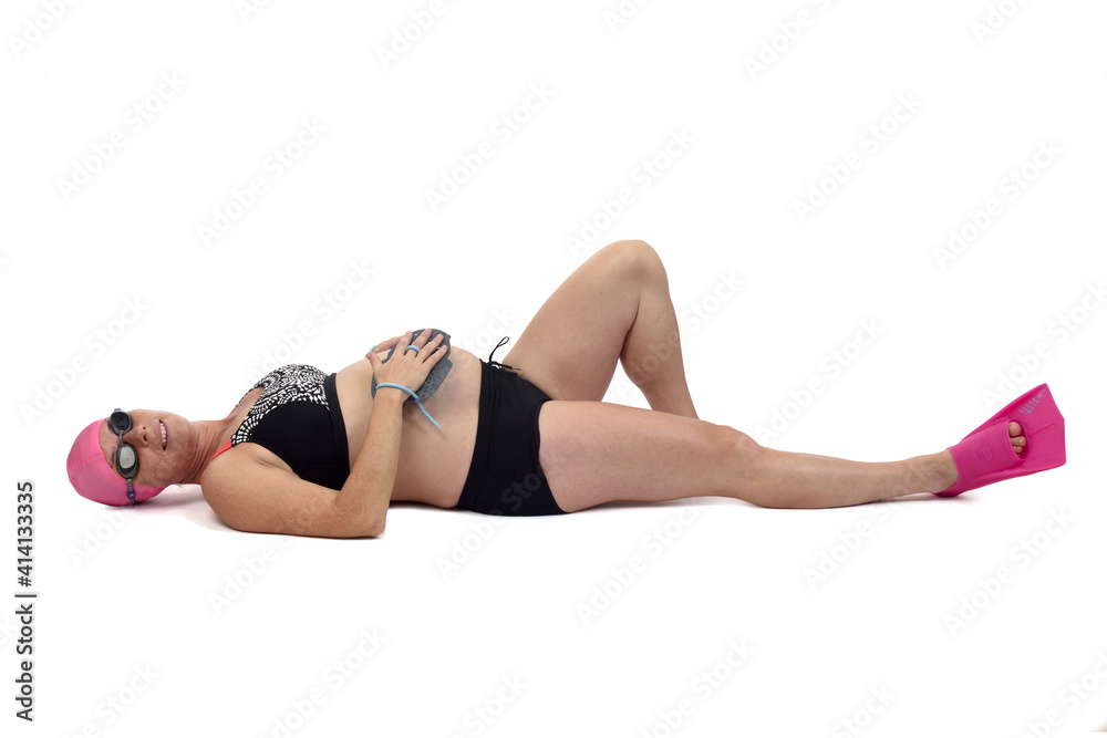 pregnant woman in swimwear lying on a white background