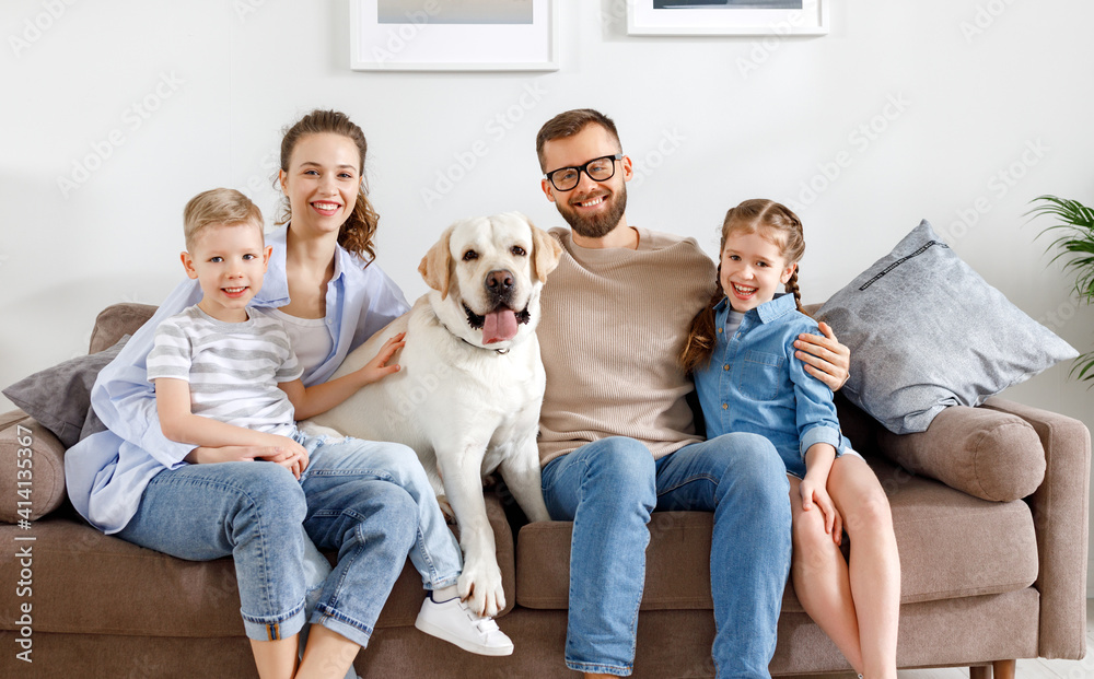 Positive family with kids and dog spending time together at home Positive family with kids and dog spending time together at home