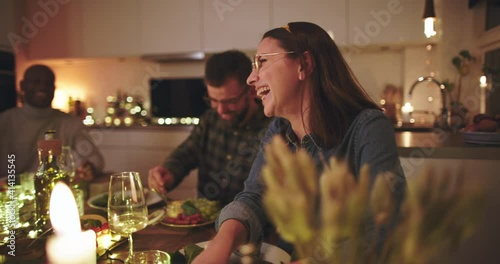 Woman laughing during
a dinner party