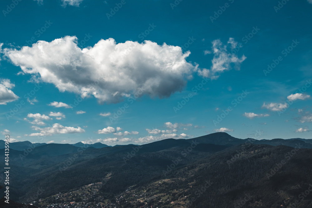 Summer landscape in mountains and the dark blue sky with clouds Summer landscape in mountains and the dark blue sky with clouds