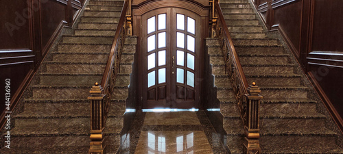beautiful front staircase with marble steps