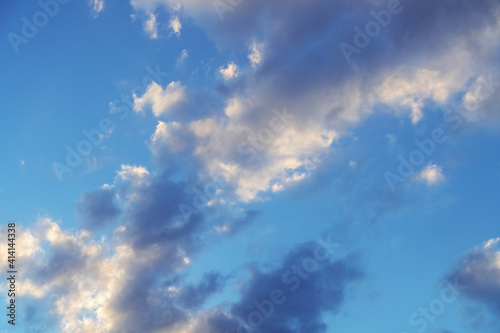 Natural sky background. Bright sunset with orange clouds.