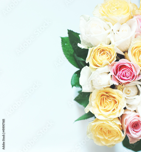 Large bouquet of many beautiful multicolored roses on a white background
