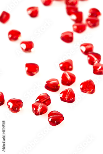 read heart-shaped beads isolated on white background