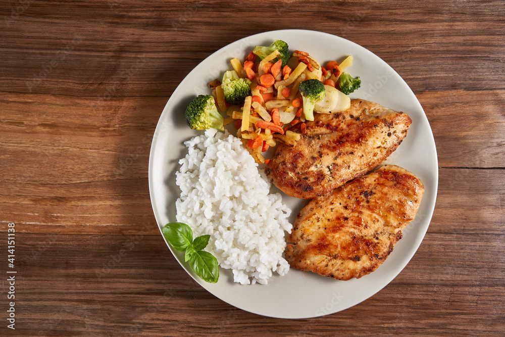 Grilled chicken breast with rice and sauteed veggies Grilled chicken breast with rice and sauteed veggies